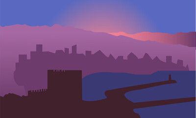 Silhouette of the city by the sea at dawn