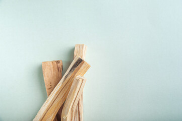 Palo Santo bars close-up and copy space. Ritual cleansing with sacred ibiocai, meditation, aromatherapy with incense and candles..