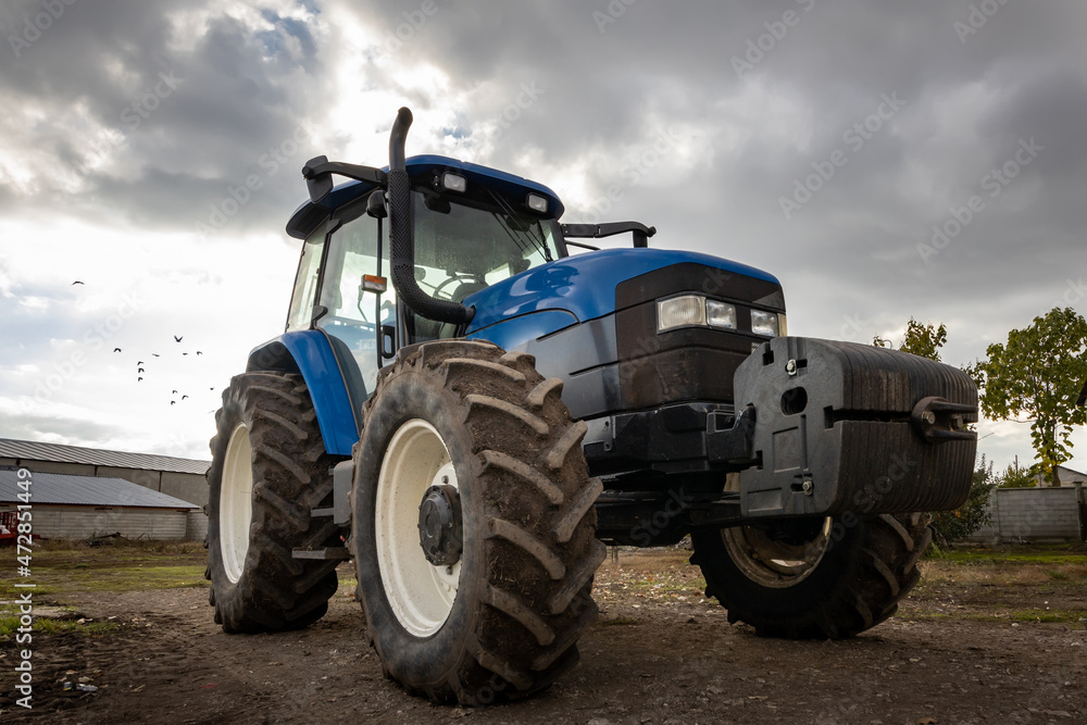 Wall mural big blue modern tractor.