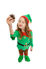 Happy smiling little girl dressed like funny gnome or elf posing isolated over white studio...