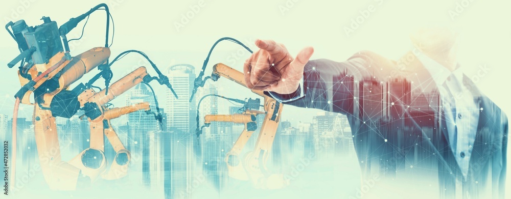Poster mechanized industry robot arm and factory worker double exposure . concept of robotics technology fo