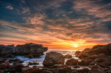 Sunset over a rocky beach on Australia