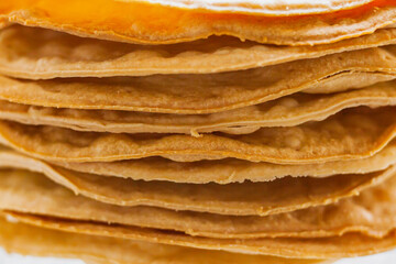 Layers of baked crumpets cakes made of puff pastry for cake. Semi-finished product for cake.