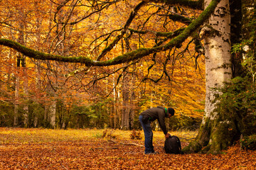 Photographer hiker enjoying the autumn scenery