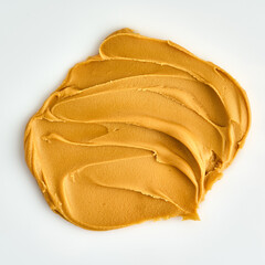 Closeup of peanut butter smear textured on white background. Snack ingredient