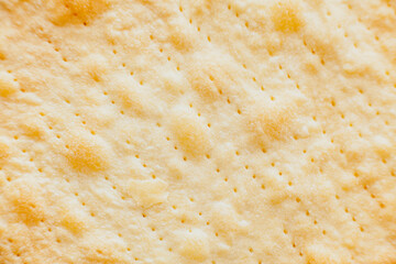 Texture of baked crumpets cakes made of puff pastry for cake. Semi-finished product for cake.