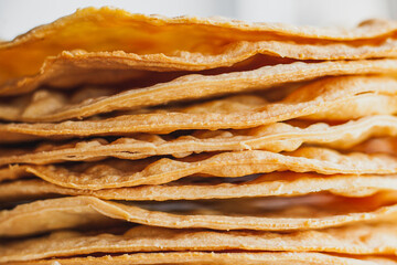 Layers of baked crumpets cakes made of puff pastry for cake. Semi-finished product for cake.