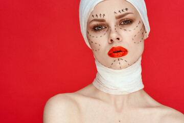 portrait of a woman posing in blue gloves red lips surgery facial rejuvenation studio lifestyle