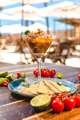 Colorful Food Appetizer Starts Snacks Fresh Delicious Menu Recipe Meal Meat Chicken Fries Fish Seafood Beer on a wooden table on the Beach