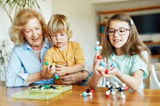 grandchild family child grandparent grandfather granddaughter grandson boy education toy boy  senior learning school girl chemistry science molecular atom biology
