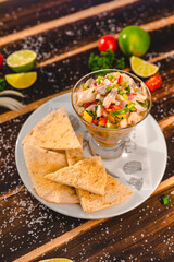 Colorful Food Appetizer Starts Snacks Fresh Delicious Menu Recipe Meal Meat Chicken Fries Fish Seafood Beer on a wooden table on the Beach