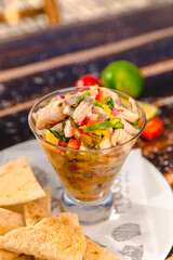 Colorful Food Appetizer Starts Snacks Fresh Delicious Menu Recipe Meal Meat Chicken Fries Fish Seafood Beer on a wooden table on the Beach