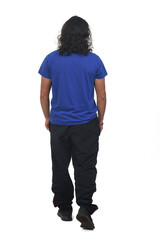 Fototapeta premium rear view of a man with sportswear walking on white background