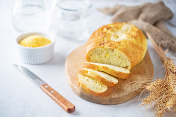 Corn wheat white bread with glasses of water