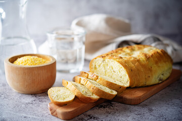 Corn wheat white bread with glasses of water