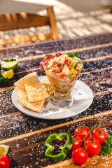 Colorful Food Appetizer Starts Snacks Fresh Delicious Menu Recipe Meal Meat Chicken Fries Fish Seafood Beer on a wooden table on the Beach