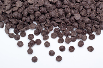 Heap of sweet tasting chocolate chips on white