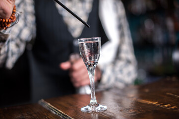Barman makes a cocktail at the public house