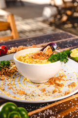 Colorful Food Appetizer Starts Snacks Fresh Delicious Menu Recipe Meal Meat Chicken Fries Fish Seafood Beer on a wooden table on the Beach