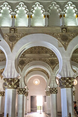 White arches at Ancient Sinagoga de Santa Maria La Blanca, Synagogue in Toledo, Spain - obrazy, fototapety, plakaty