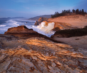 USA, Oregon, Cape Kiwanda. Waves pounding on cliffs.