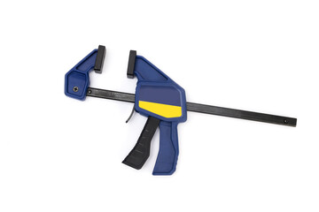 Modern bar clamp with quick release. Carpenters and joiners one handed spring lever quick release clamp for temporary holding of wood and objects in the shop and on site