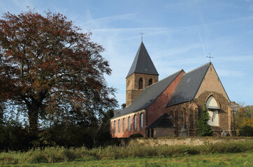 St-Peters church, a small thirteenth-century church, on the bank of the River Demer. In Langdorp near Aarschot. In the Flemish Hageland. Belgium