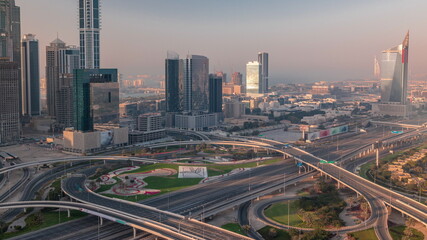 Naklejka na ściany i meble Highway crossroad and office buildings in Dubai Internet City and Media City district aerial timelapse