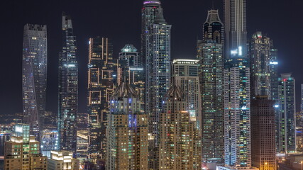 Skyscrapers of Dubai Marina near Sheikh Zayed Road with highest residential buildings all night timelapse