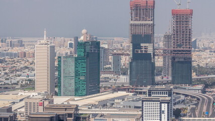 Aerial view of skyscrapers with World Trade center in Dubai timelapse.