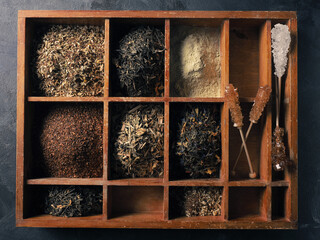 Different kinds of tea in the wooden box, view from above