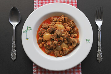 Traditional Turkish meal with delicious meat; onion stew with meat (Turkish name; etli sogan...