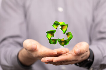 Fototapeta na wymiar hand holding green recycle symbol