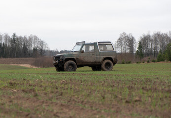 Dirty jeep on the field