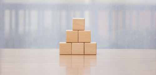Businessman arrange wooden blocks stacked in uneven steps like obstacles, business growth journey...