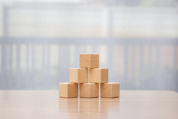 Businessman arrange wooden blocks stacked in uneven steps like obstacles, business growth journey...
