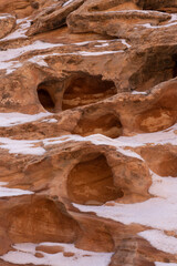 USA, Utah. Abstract sandstone design with snow, Little Wild Horse Canyon, San Rafael Swell.
