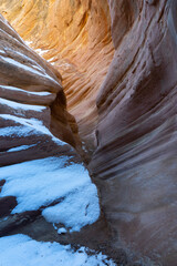 USA, Utah. Abstract sandstone design with snow, Little Wild Horse Canyon, San Rafael Swell.