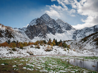 travel to Caucasus mountains in Karachay-Cherkessia, Arkhyz. Beautiful mountain landscape. Lake Orlyonok with Mount Karadzhash, autumn season