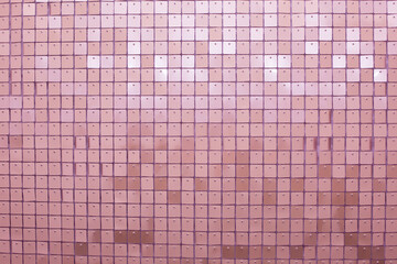 Fototapeta premium Pink glittering sequin background. Holiday decoration with sparkle sequin texture