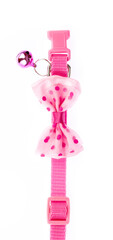 Pink pet collar with polka dots and bow tie isolated on white background