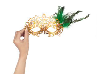 Hand holding beautiful of carnival mask with feather isolated on a white background.