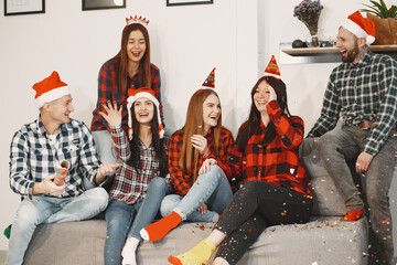 Young people celebrating New Year at home party