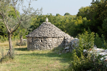 A Kazun is a native Mediterranean round house with conical roof. The house is built of dry stone without any other material. It is used as a shelter or for storage... - 472877862