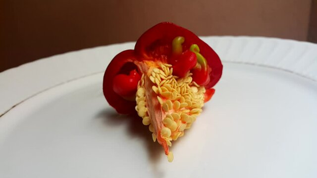 red pepper seeds in white plate
