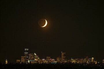 Usa, Washington State, Downtown Seattle under a crescent moon, view from Bellevue