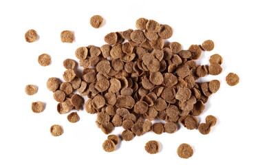 Crunchy corn flakes with cocoa, cereal, muesli pile isolated on white background, top view