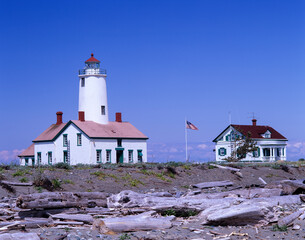 Fototapeta na wymiar Washington State, Sequim, New Dungeness Lighthouse on Dungeness Bay, established 1857, with keeper's quarters and beach
