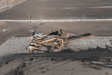 Aerial photo showing large machinery and equipment used for sorting and processing harvested sugar beets Drone directly above Winter time, North Dakota.