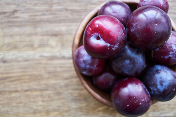 plums fruits natural products on a wooden table top view